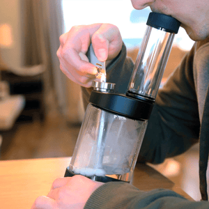 types of bongs with a guy smoking a bong